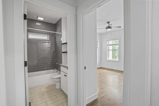 a bathroom with a bathtub and a shower
