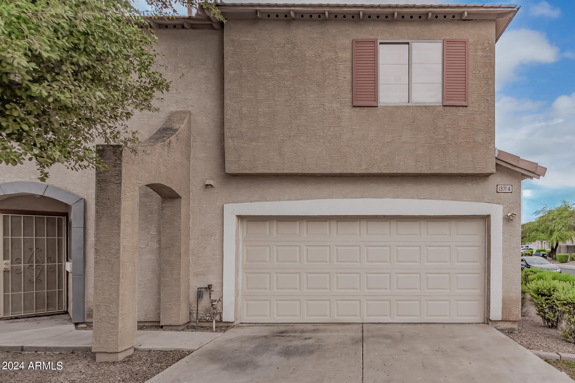 1371 South Boulder Street, Unit A Gilbert, AZ 85296 - Photo 2 of 43 a front view of a house