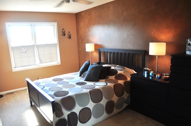 127 Barnes Road Elgin, IL 60124 - Photo 10 of 19 a bedroom with a bed and wooden floor