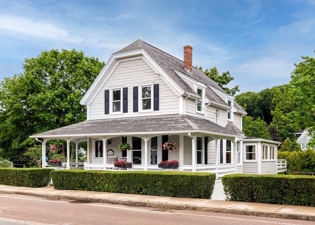 24 Main Street Hull, MA 02045 - Photo 1 of 19 a front view of a house with a yard