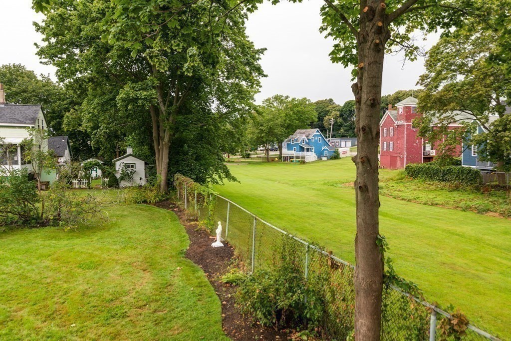 24 Main Street Hull, MA 02045 - Photo 13 of 19 a view of a yard with an trees