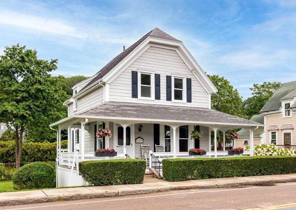 24 Main Street Hull, MA 02045 - Photo 2 of 19 a front view of a house with a yard