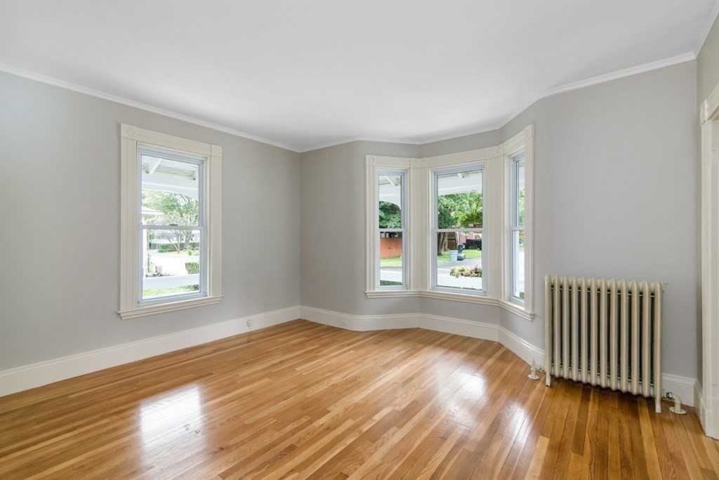 24 Main Street Hull, MA 02045 - Photo 7 of 19 a view of an empty room with wooden floor and a window
