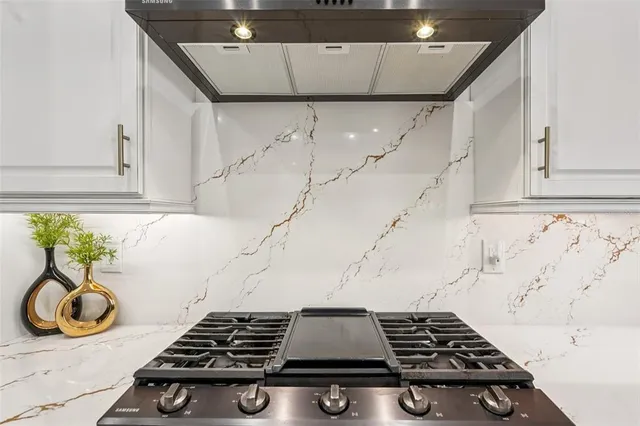 a dining room with furniture and a floor to ceiling window