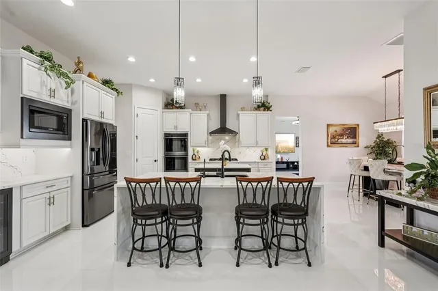 a view of a house with backyard sitting area and garden