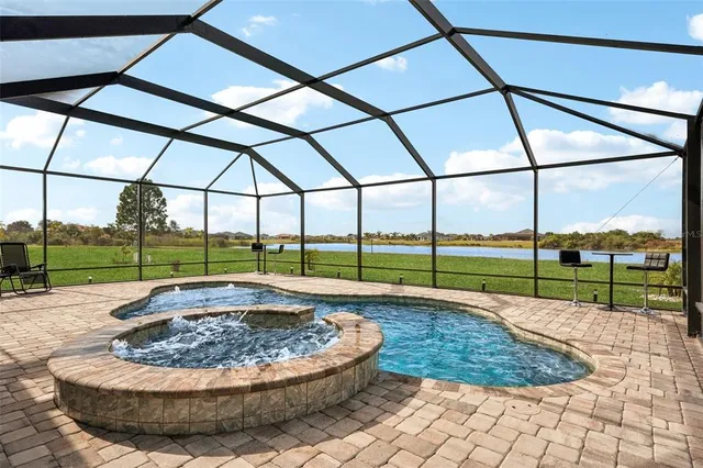 a living room with furniture and a dining table