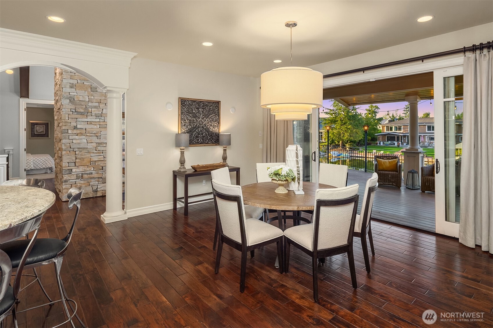 67 Cascade Key Bellevue, WA 98006 - Photo 12 of 39 a dining room with furniture a chandelier and wooden floor