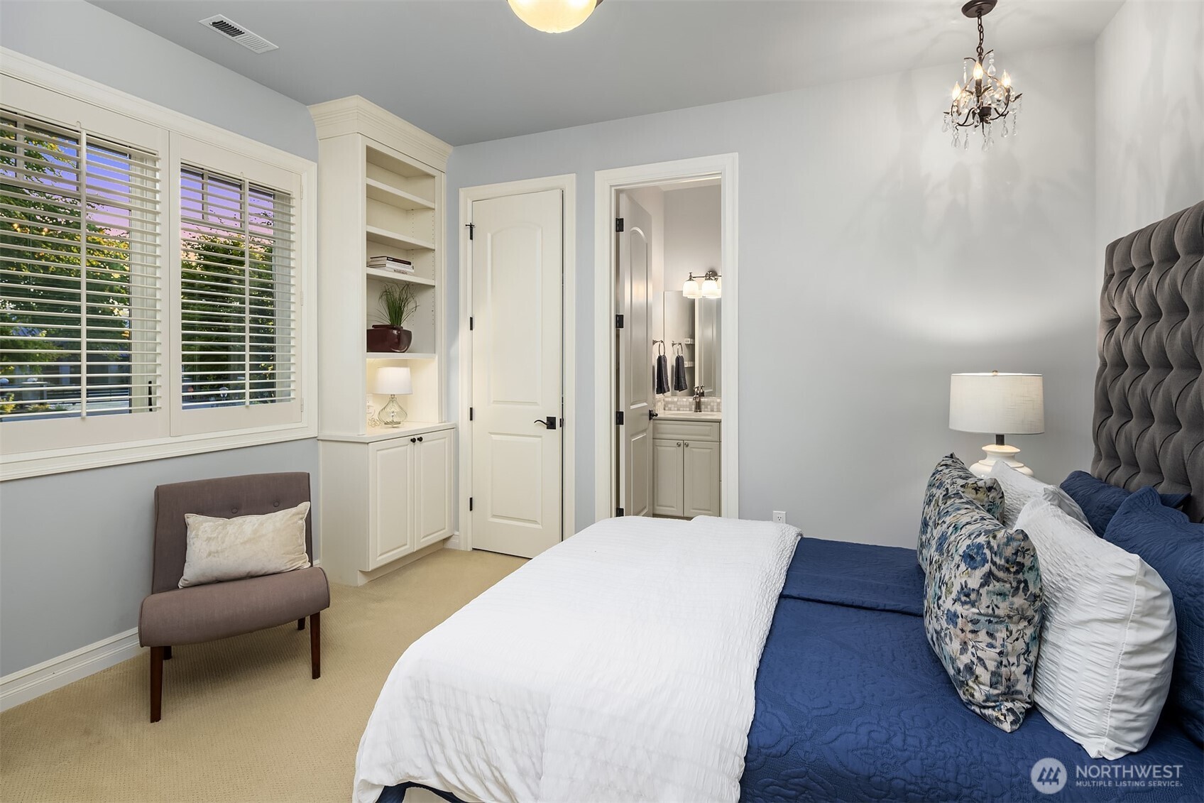 67 Cascade Key Bellevue, WA 98006 - Photo 28 of 39 a bedroom with a bed and wooden floor