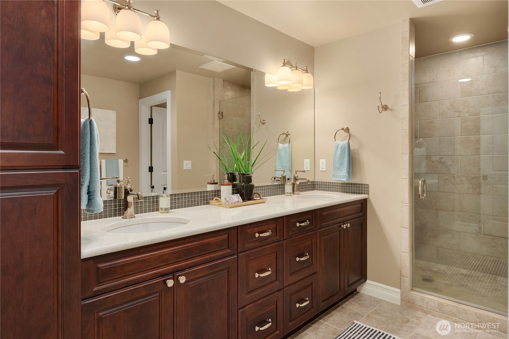 67 Cascade Key Bellevue, WA 98006 - Photo 29 of 39 a bathroom with a double vanity sink and a mirror