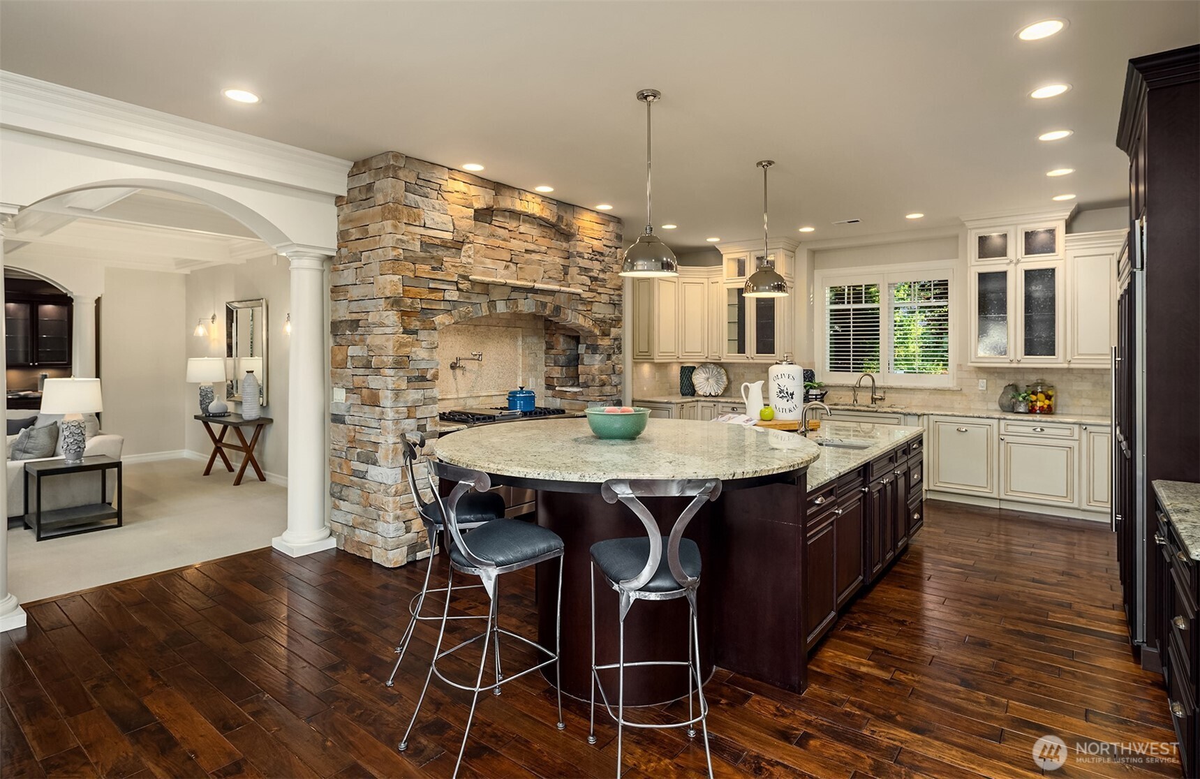 67 Cascade Key Bellevue, WA 98006 - Photo 9 of 39 a kitchen with stainless steel appliances kitchen island granite countertop a table chairs and a chandelier