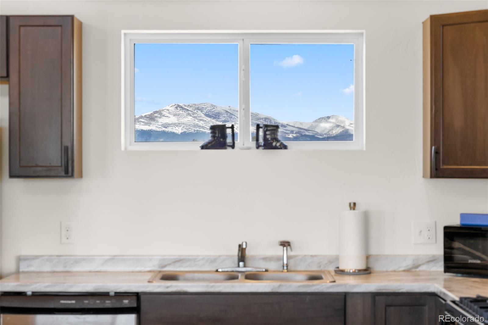431 Rudisill Street Fairplay, CO 80440 - Photo 11 of 48 a bathroom with a granite countertop sink and two large mirror