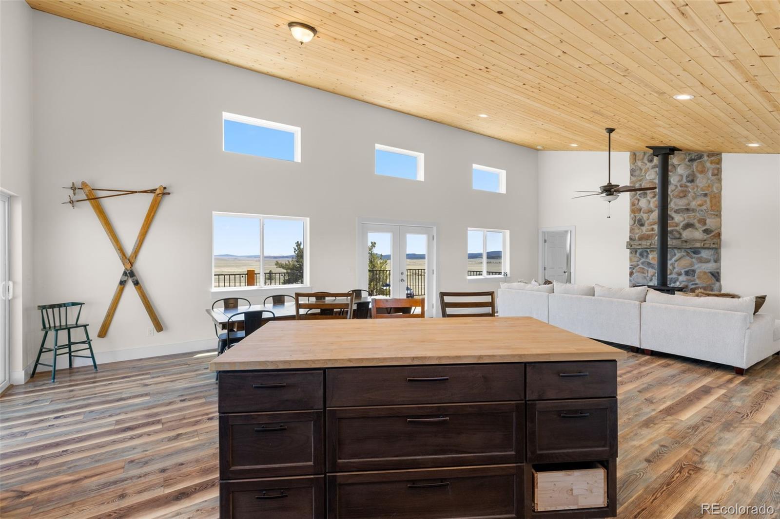 431 Rudisill Street Fairplay, CO 80440 - Photo 17 of 48 a room with a bed a dresser and wooden floor