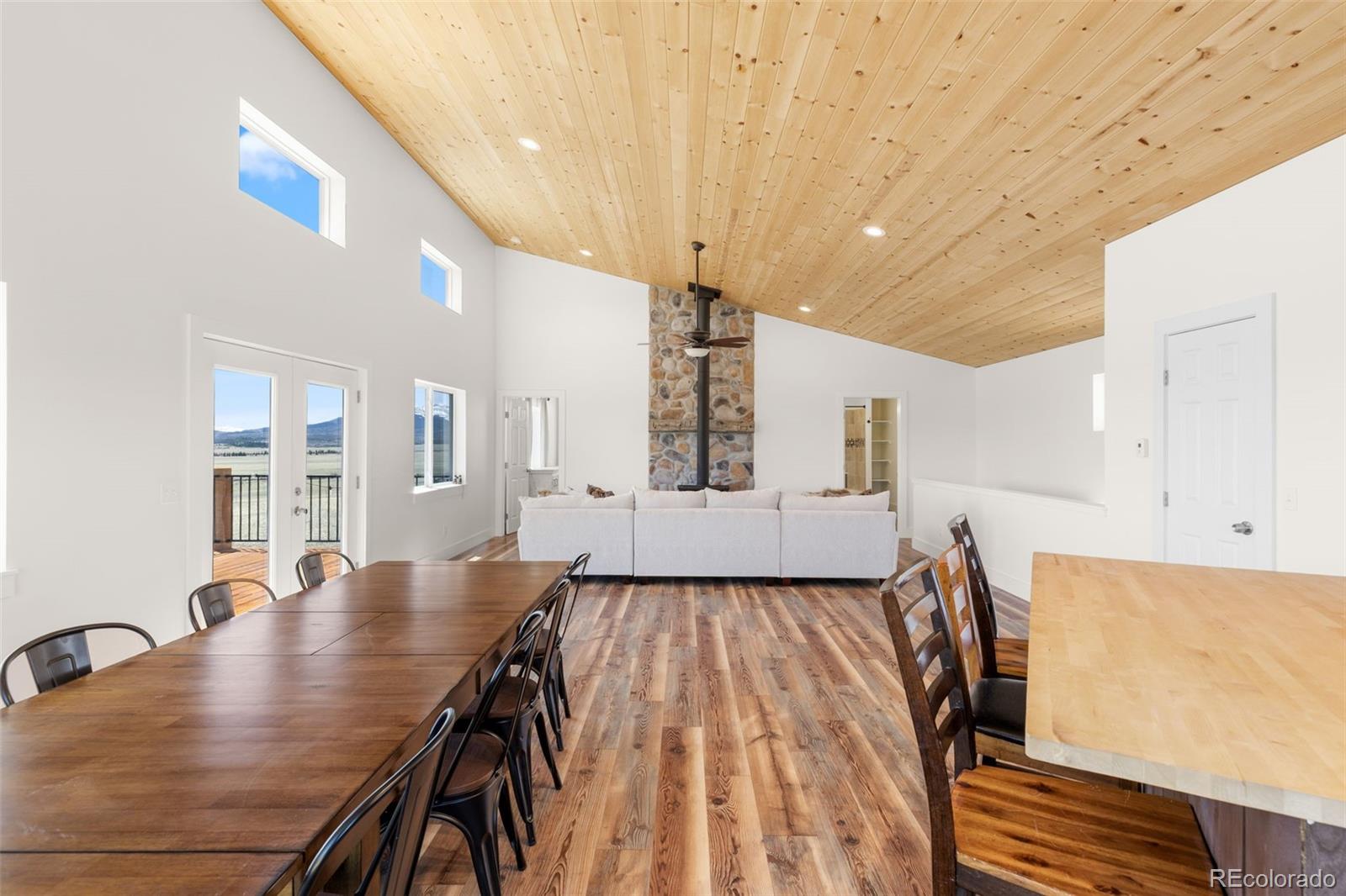 431 Rudisill Street Fairplay, CO 80440 - Photo 18 of 48 a living room with kitchen island stainless steel appliances furniture stove and wooden floor