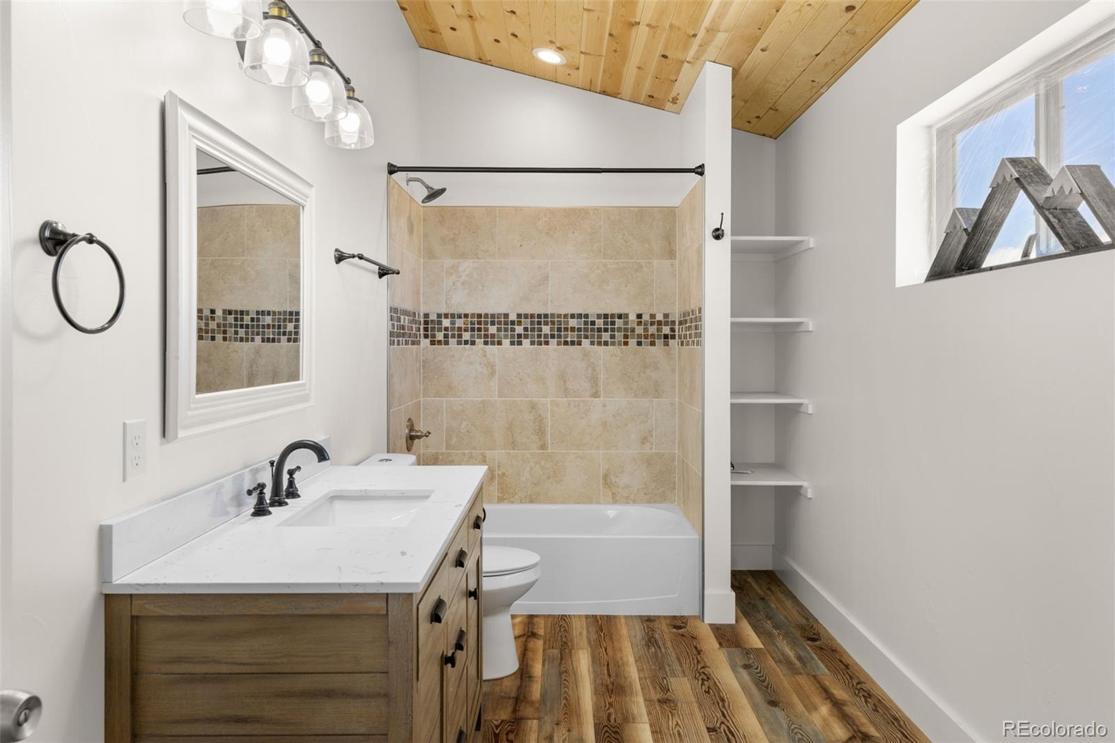 431 Rudisill Street Fairplay, CO 80440 - Photo 25 of 48 a bathroom with a sink and a mirror