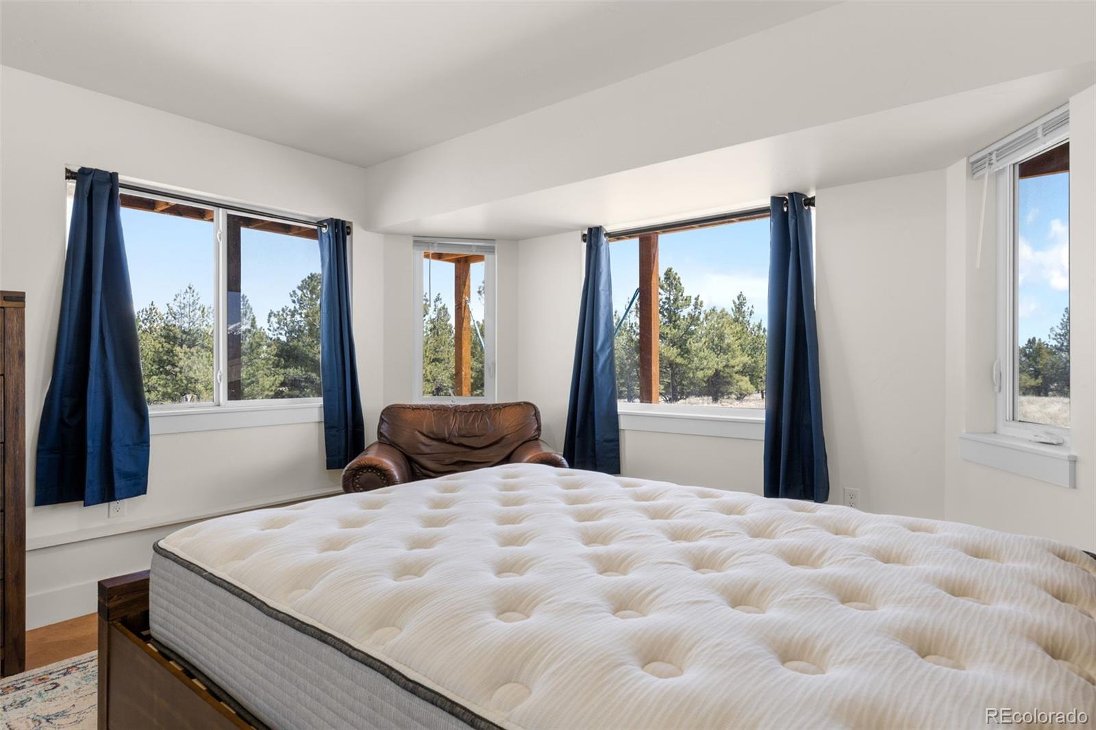 431 Rudisill Street Fairplay, CO 80440 - Photo 32 of 48 a bed sitting in a bedroom next to a window