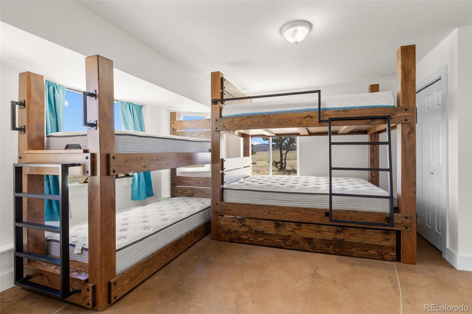 431 Rudisill Street Fairplay, CO 80440 - Photo 35 of 48 a bedroom with furniture and a window