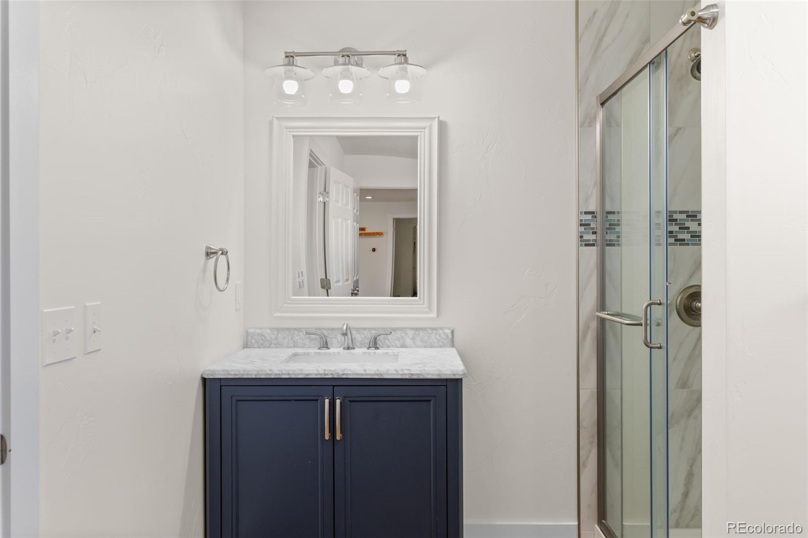 431 Rudisill Street Fairplay, CO 80440 - Photo 37 of 48 a bathroom with a sink vanity and mirror