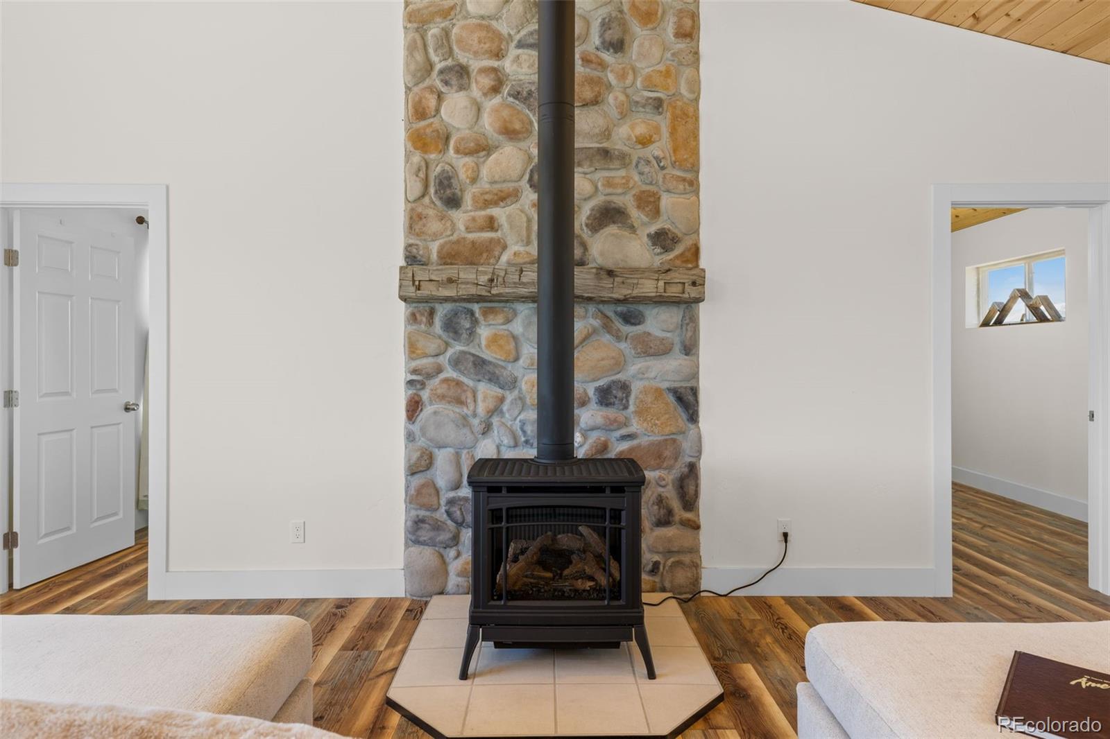 431 Rudisill Street Fairplay, CO 80440 - Photo 6 of 48 a living room with furniture and a fireplace