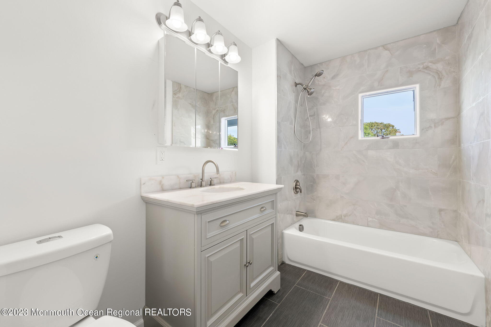 3 Hickory Hill Road Toms River, NJ 08753 - Photo 17 of 27 a bathroom with a granite countertop sink a toilet and bathtub