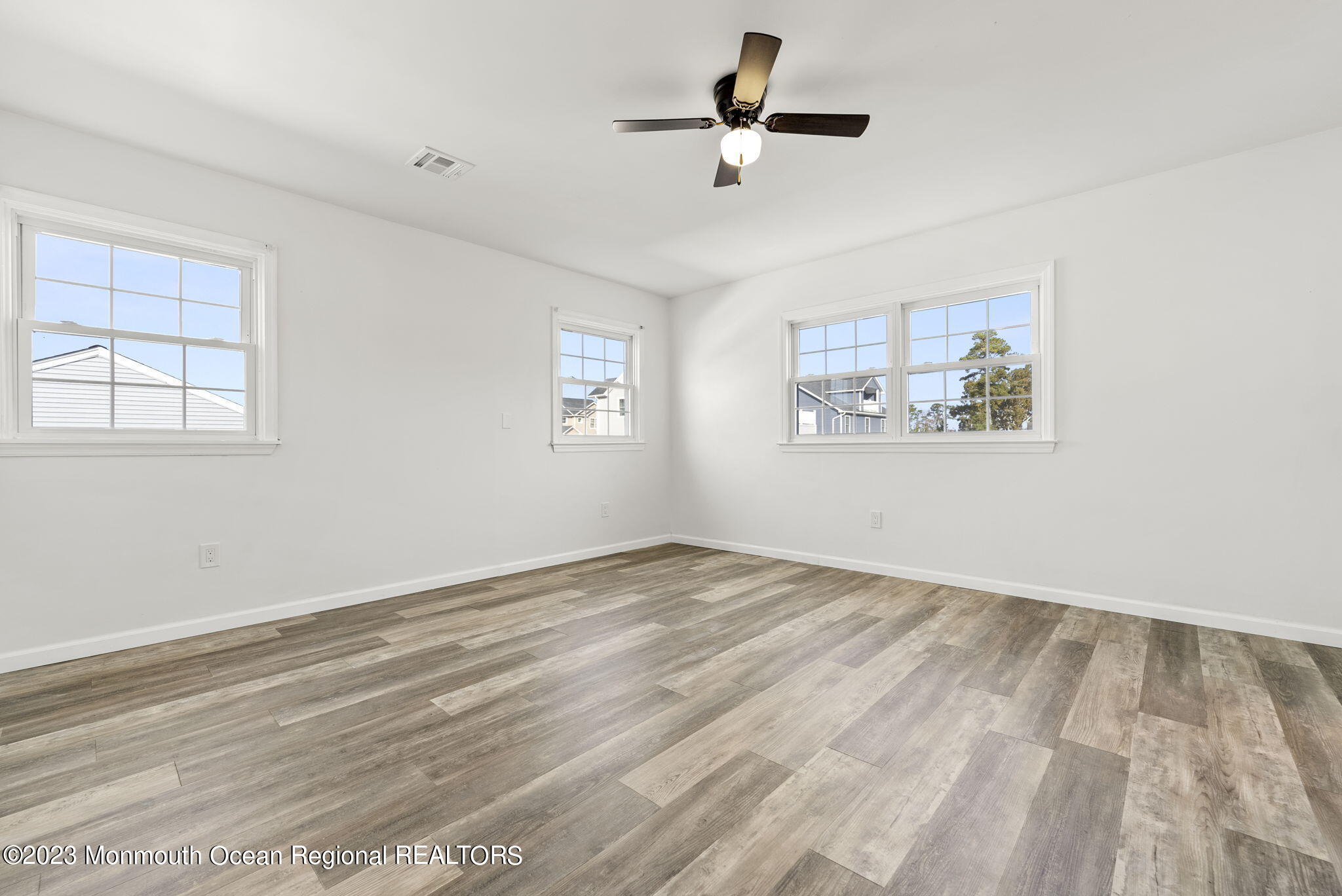 3 Hickory Hill Road Toms River, NJ 08753 - Photo 21 of 27 a view of empty room with wooden floor and window