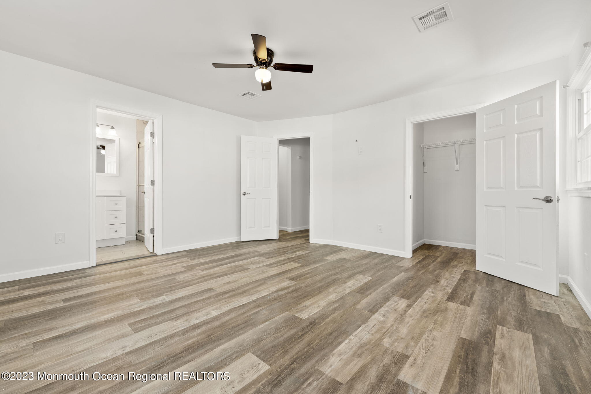 3 Hickory Hill Road Toms River, NJ 08753 - Photo 23 of 27 a view of empty room with wooden floor and ceiling fan