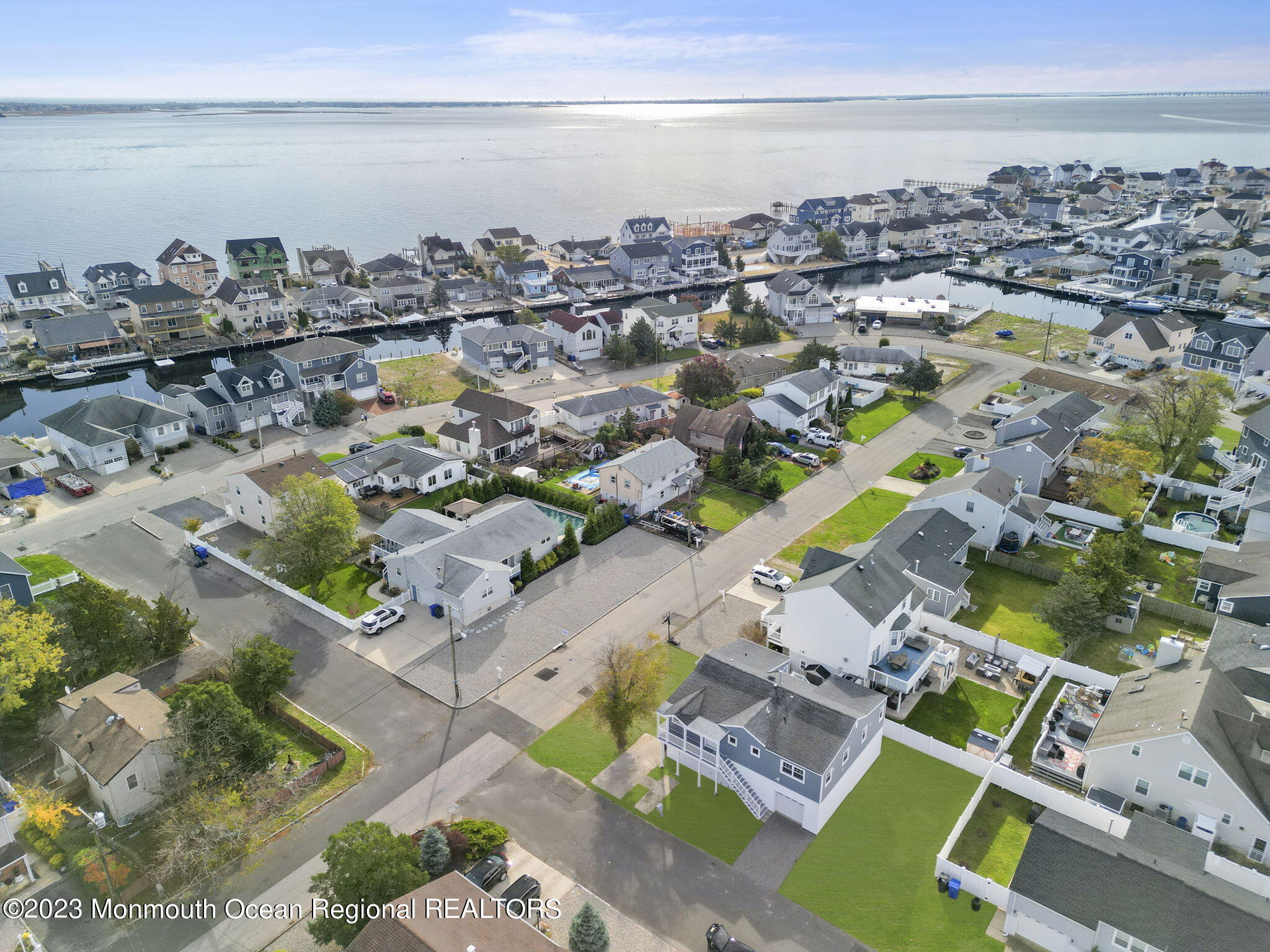 3 Hickory Hill Road Toms River, NJ 08753 - Photo 3 of 27 an aerial view of a city with lots of residential buildings and ocean view in back