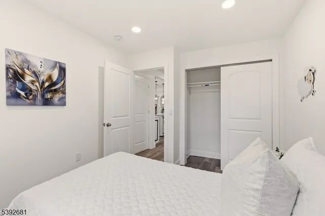 a bedroom with a bed and a shower