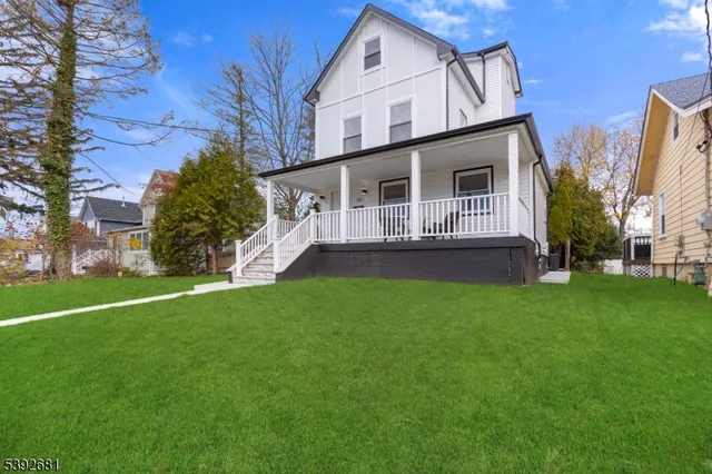a view of house with backyard