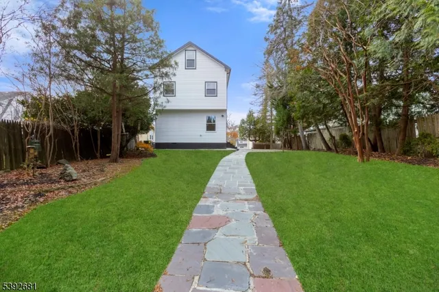 a view of a park with large trees