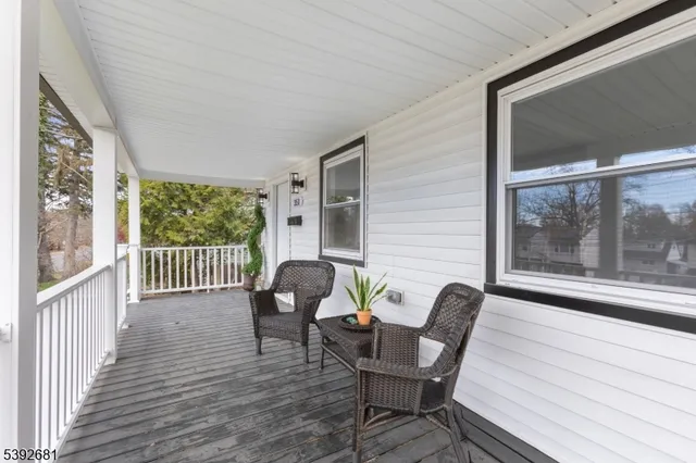 a view of a two chairs in the balcony
