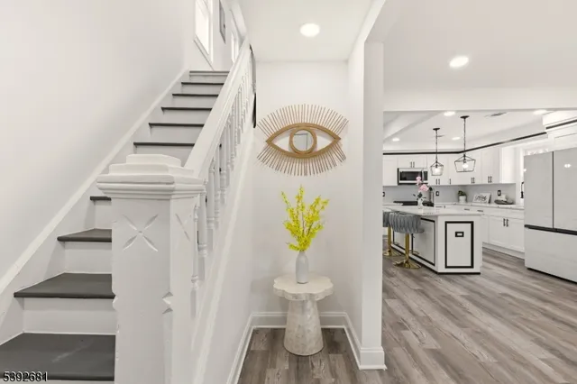 a kitchen with a sink appliances and cabinets