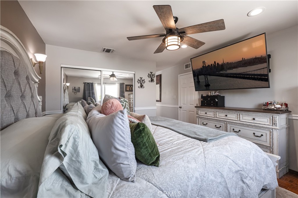 2203 Homewood Avenue Simi Valley, CA 93063 - Photo 28 of 37 a spacious bedroom with a bed and a flat screen tv