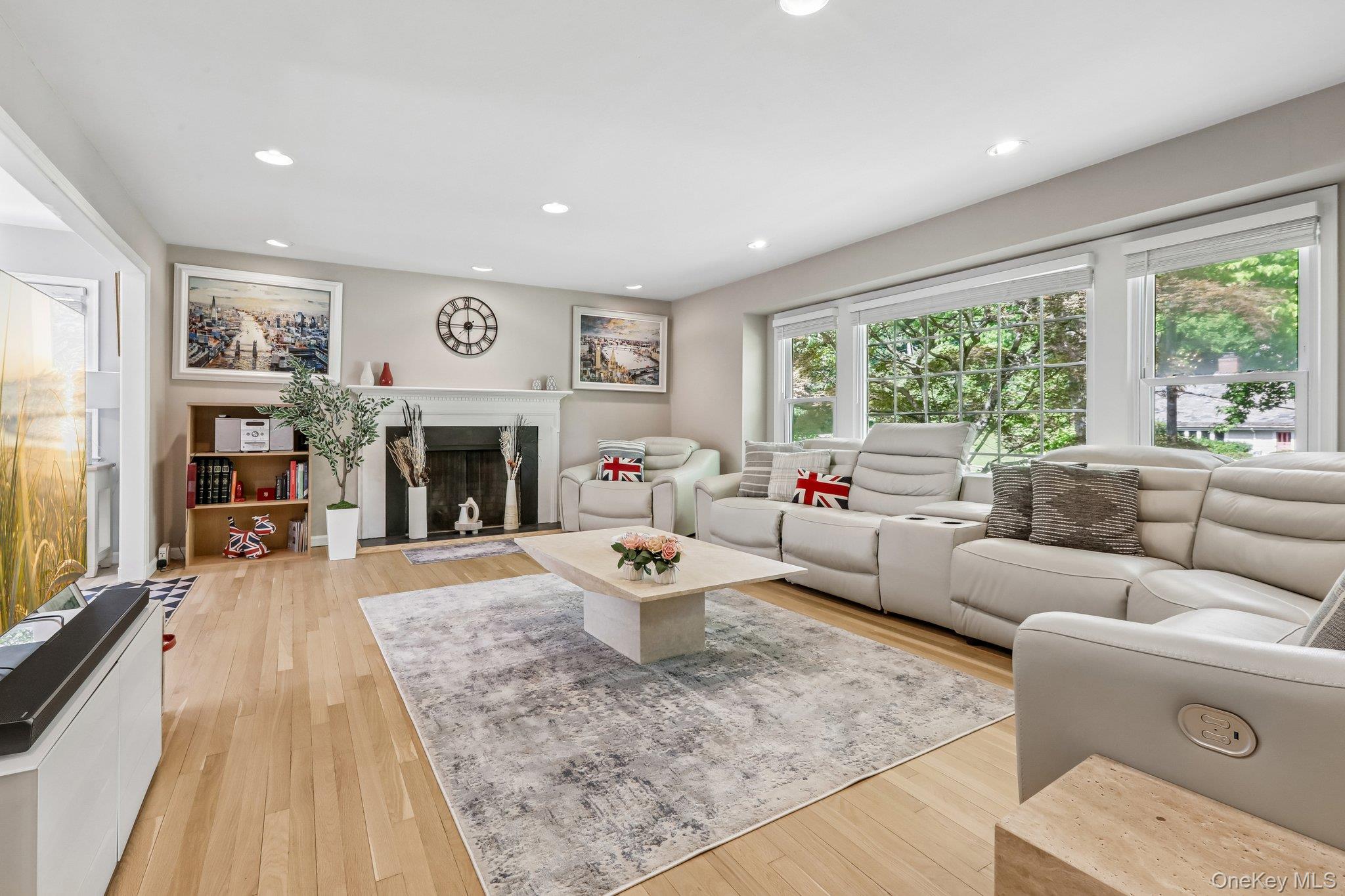 62 Mohegan Road Larchmont, NY 10538 - Photo 11 of 46 a living room with furniture large window and a fireplace