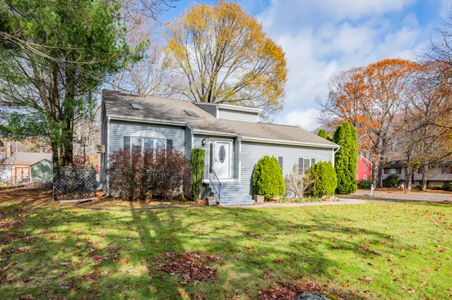 a front view of a house with a yard