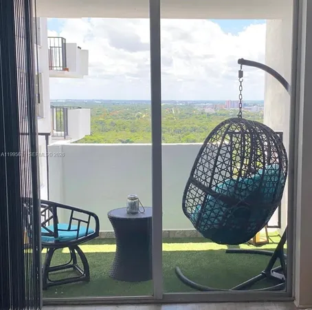 a view of swimming pool from a balcony