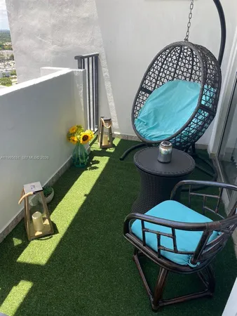 a front view of a house with backyard and sitting area
