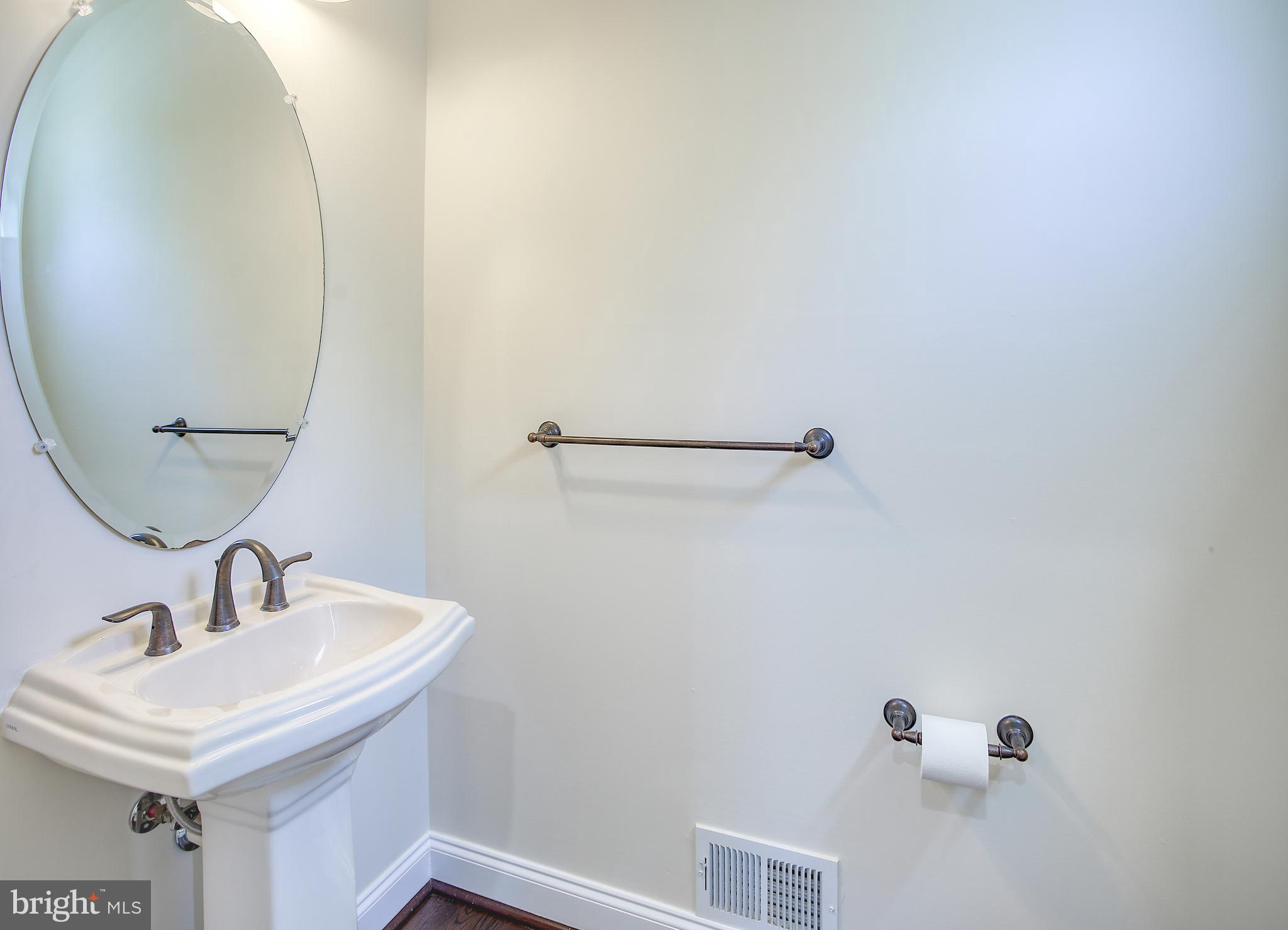 13501 Moonlight Trail Drive Silver Spring, MD 20906 - Photo 14 of 77 a bathroom with a sink and mirror
