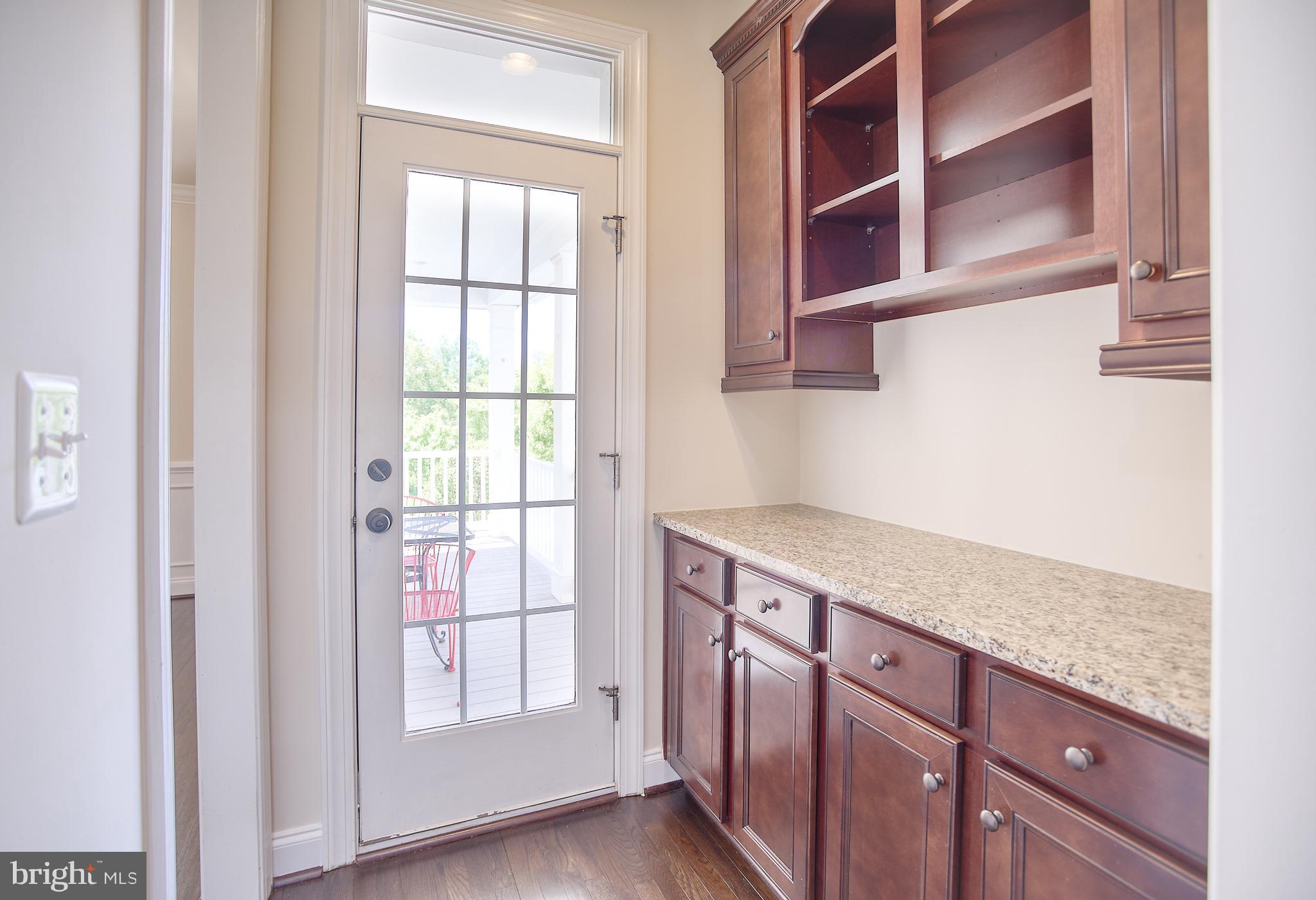 13501 Moonlight Trail Drive Silver Spring, MD 20906 - Photo 22 of 77 a kitchen with a sink cabinets and a window