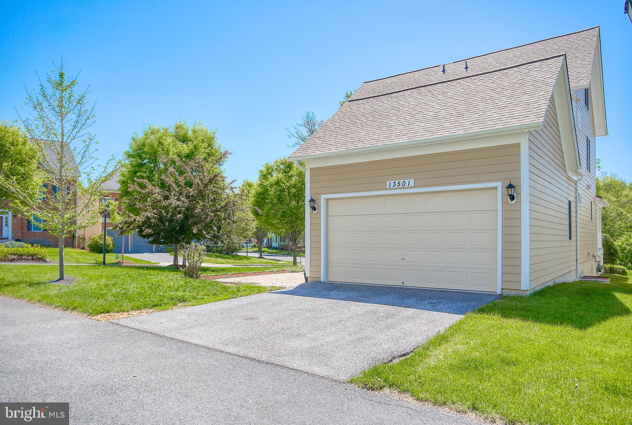 13501 Moonlight Trail Drive Silver Spring, MD 20906 - Photo 30 of 77 a front view of house with yard and green space
