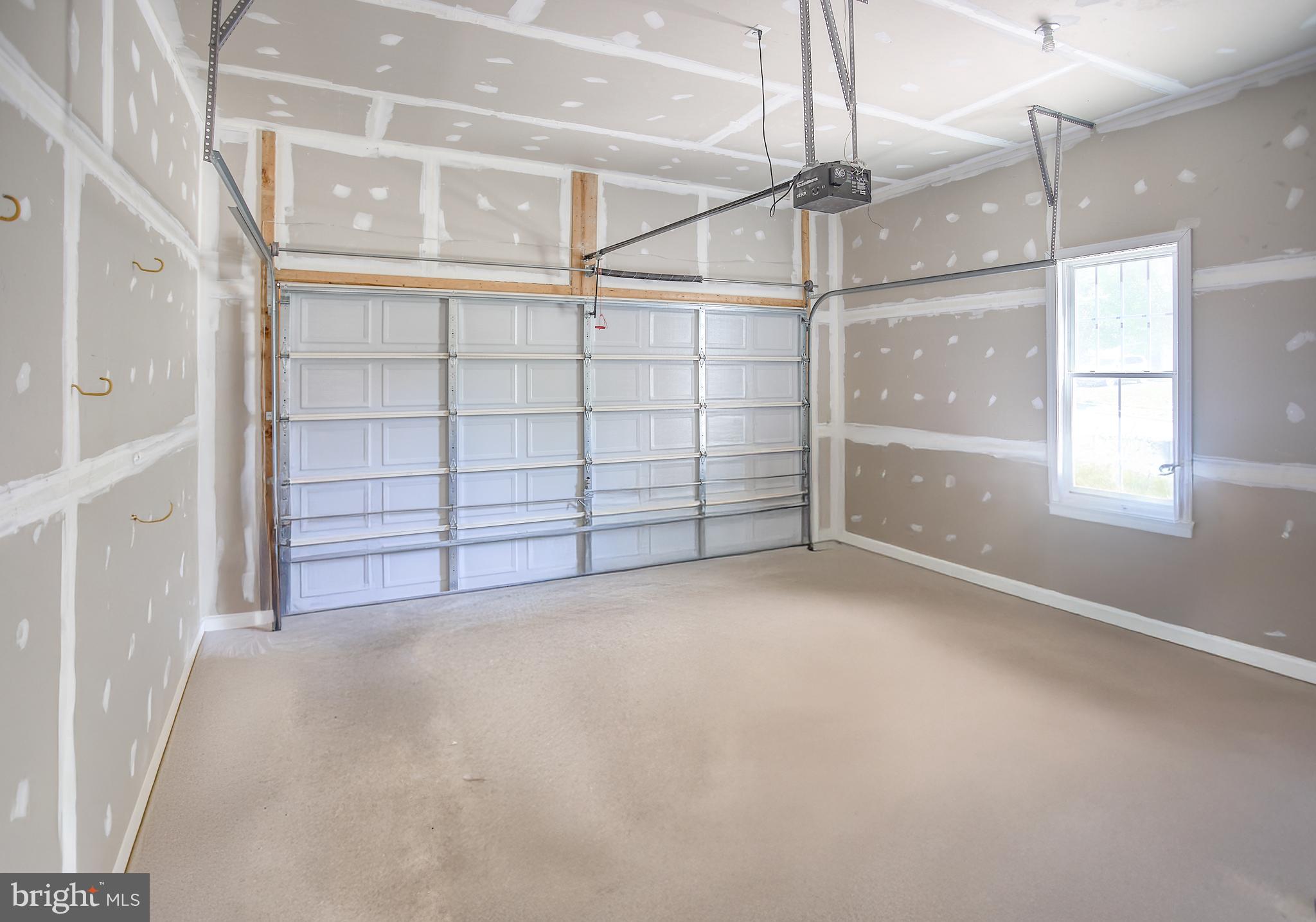 13501 Moonlight Trail Drive Silver Spring, MD 20906 - Photo 33 of 77 an empty room with windows and cabinet