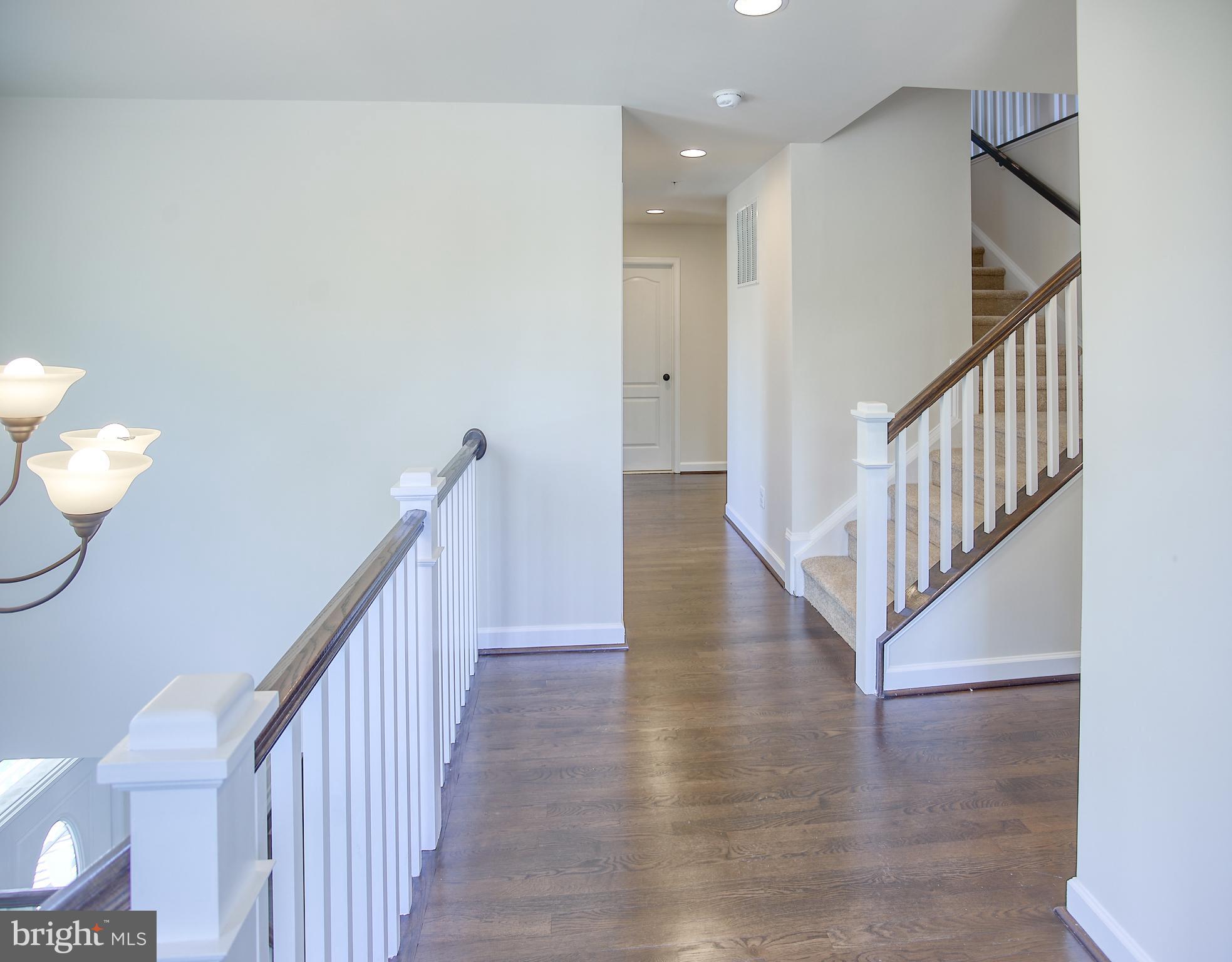 13501 Moonlight Trail Drive Silver Spring, MD 20906 - Photo 34 of 77 a view of entryway and hall with wooden floor