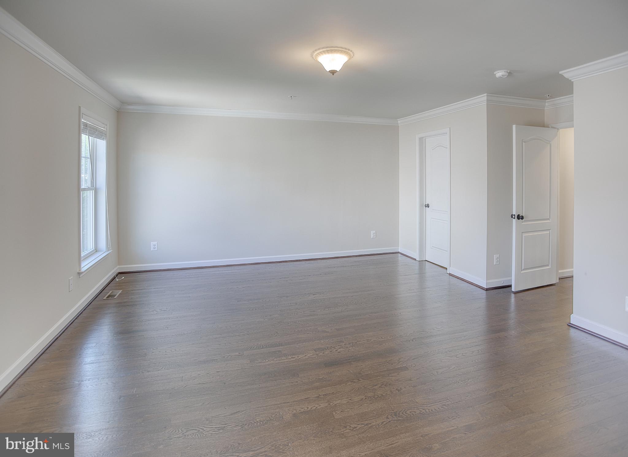 13501 Moonlight Trail Drive Silver Spring, MD 20906 - Photo 37 of 77 a view of wooden floor and windows in a room