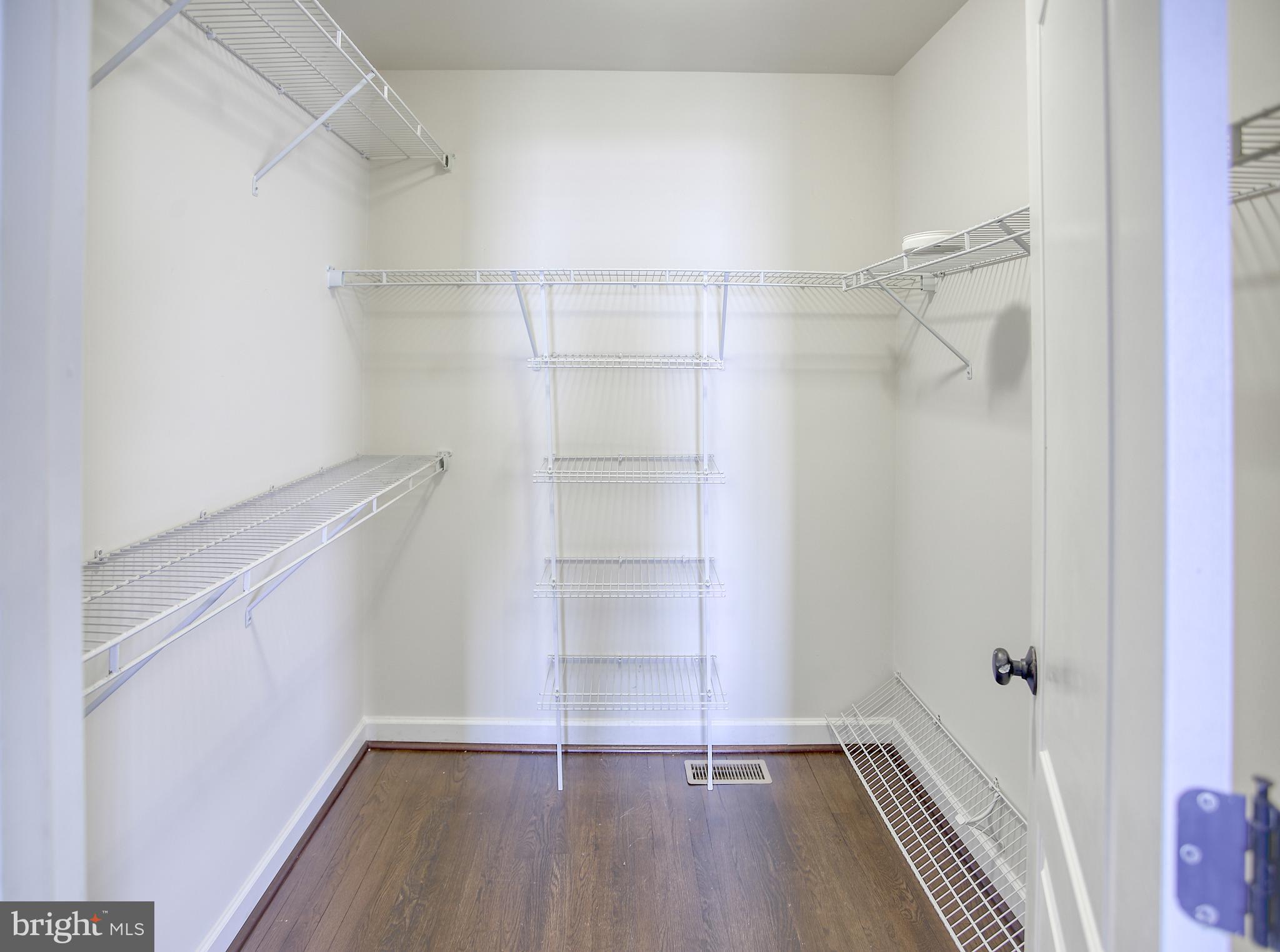 13501 Moonlight Trail Drive Silver Spring, MD 20906 - Photo 38 of 77 a view of walk in closet with empty racks