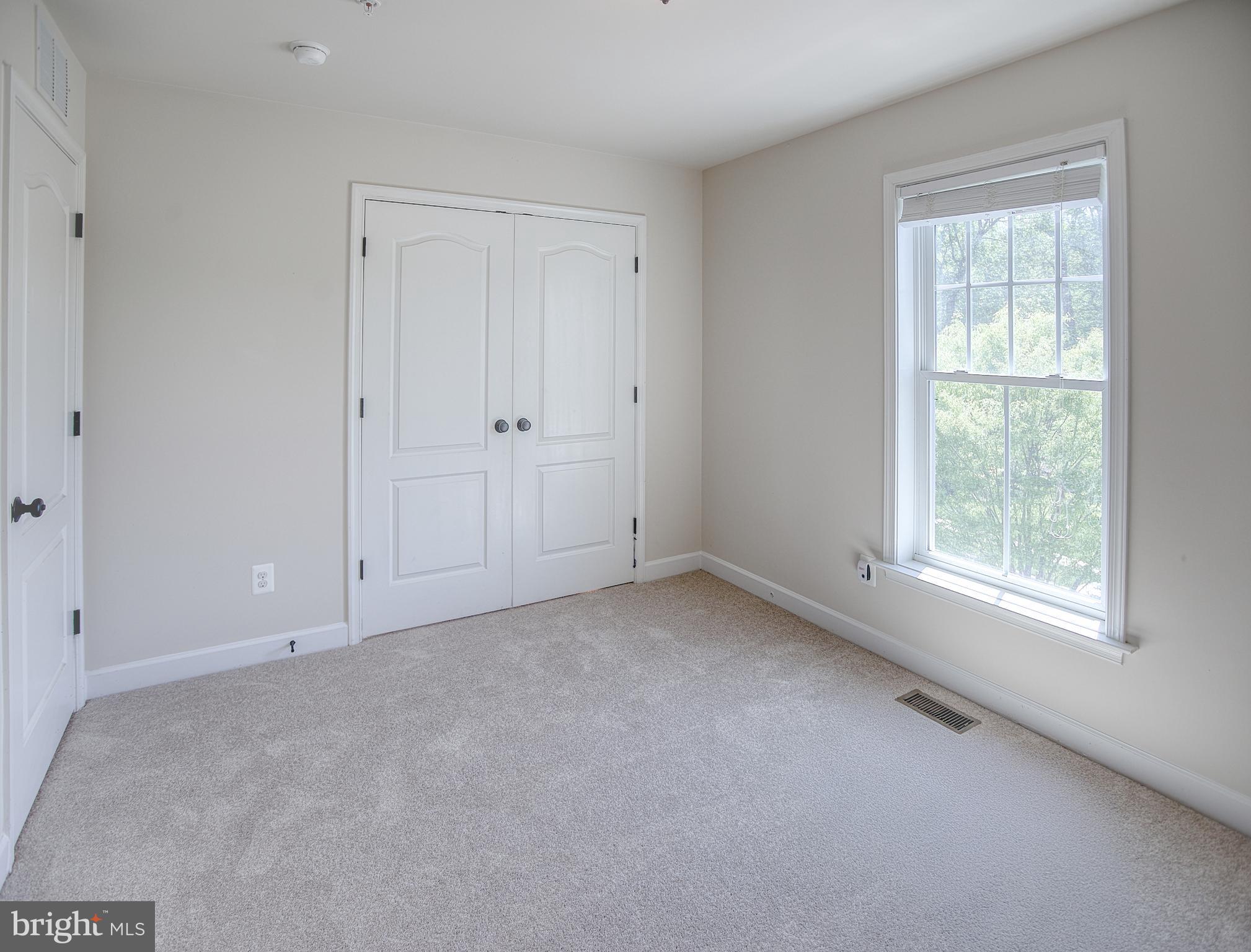 13501 Moonlight Trail Drive Silver Spring, MD 20906 - Photo 45 of 77 a view of an empty room with a window