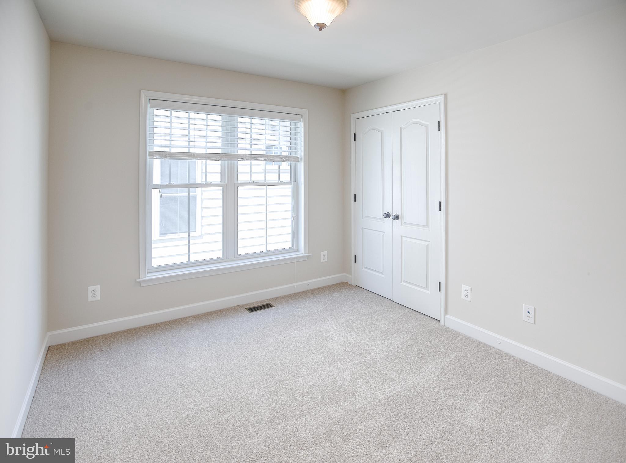 13501 Moonlight Trail Drive Silver Spring, MD 20906 - Photo 47 of 77 an empty room with windows and closet