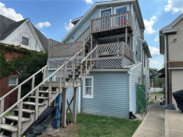 a view of entryway with wooden stairs