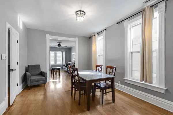 a view of a livingroom with furniture window and wooden floor