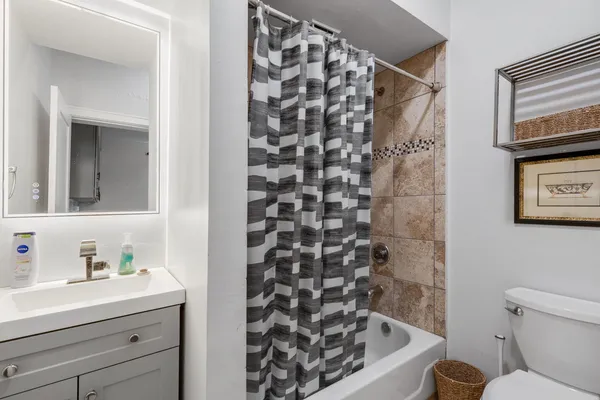 a bathroom with a bathtub and sink