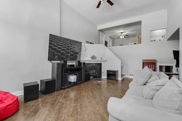 a living room with furniture and a fireplace
