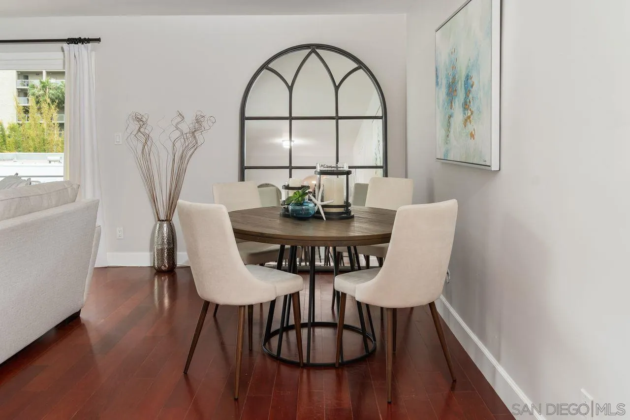 2362 Torrey Pines Road, Unit 33 La Jolla, CA 92037 - Photo 11 of 32 a view of a dining room with furniture window and wooden floor